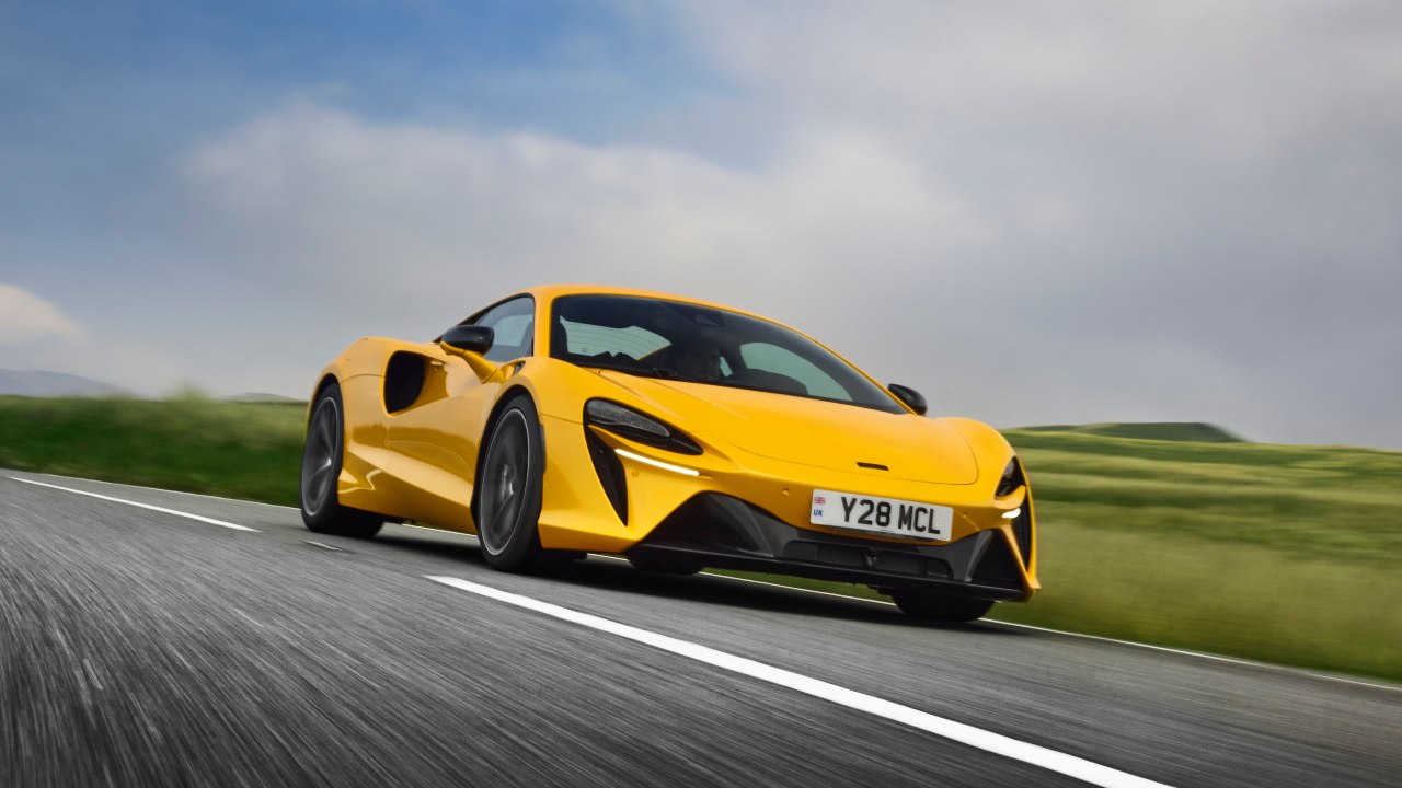 Mclaren Artura Orange driving front left