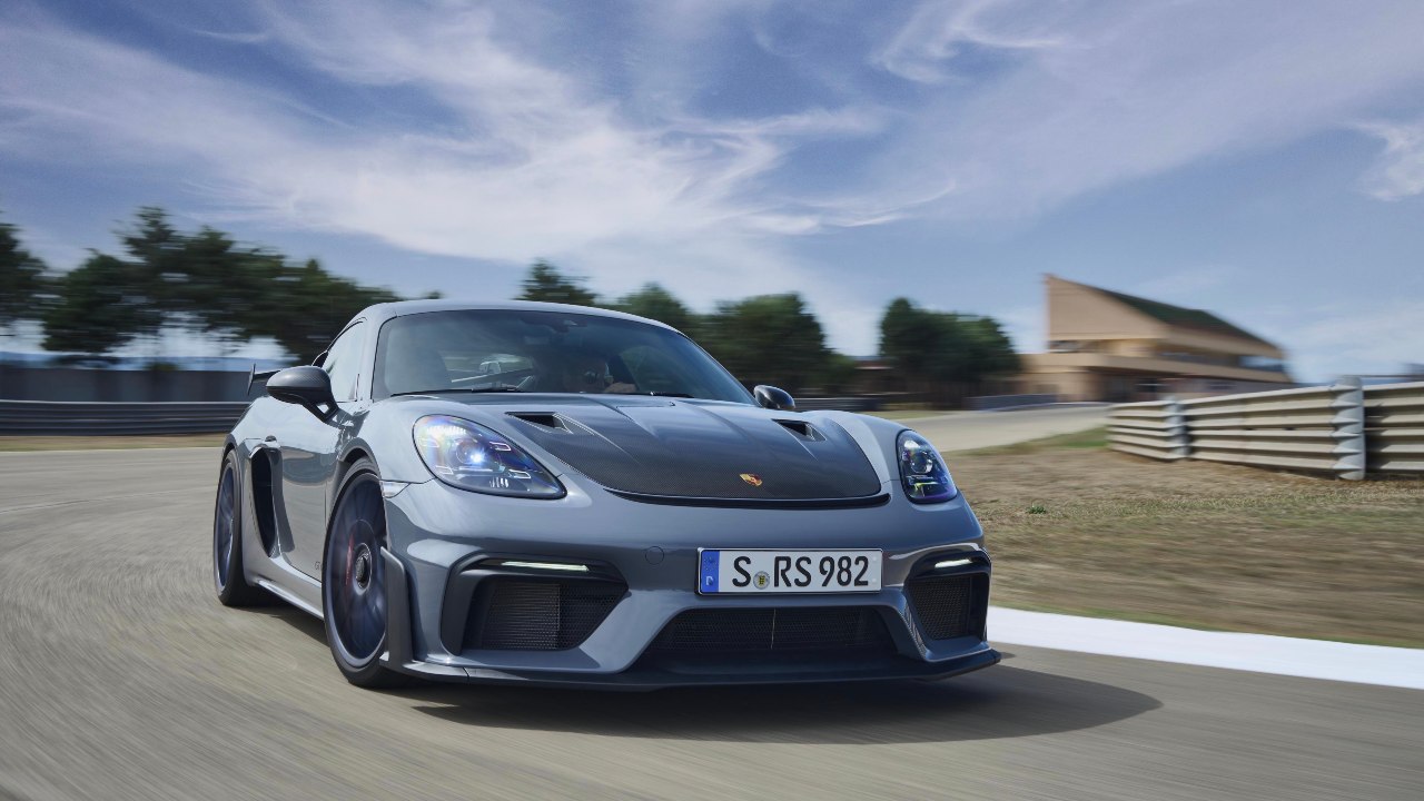 Porsche Cayman GT4-RS Driving on track front left