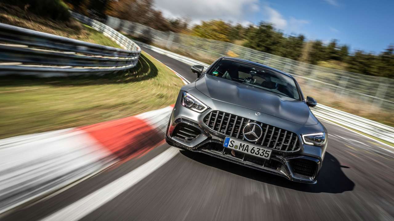 Mercedes-AMG GT 63 4-Door Coupe cornering at speed on racetrack, front view