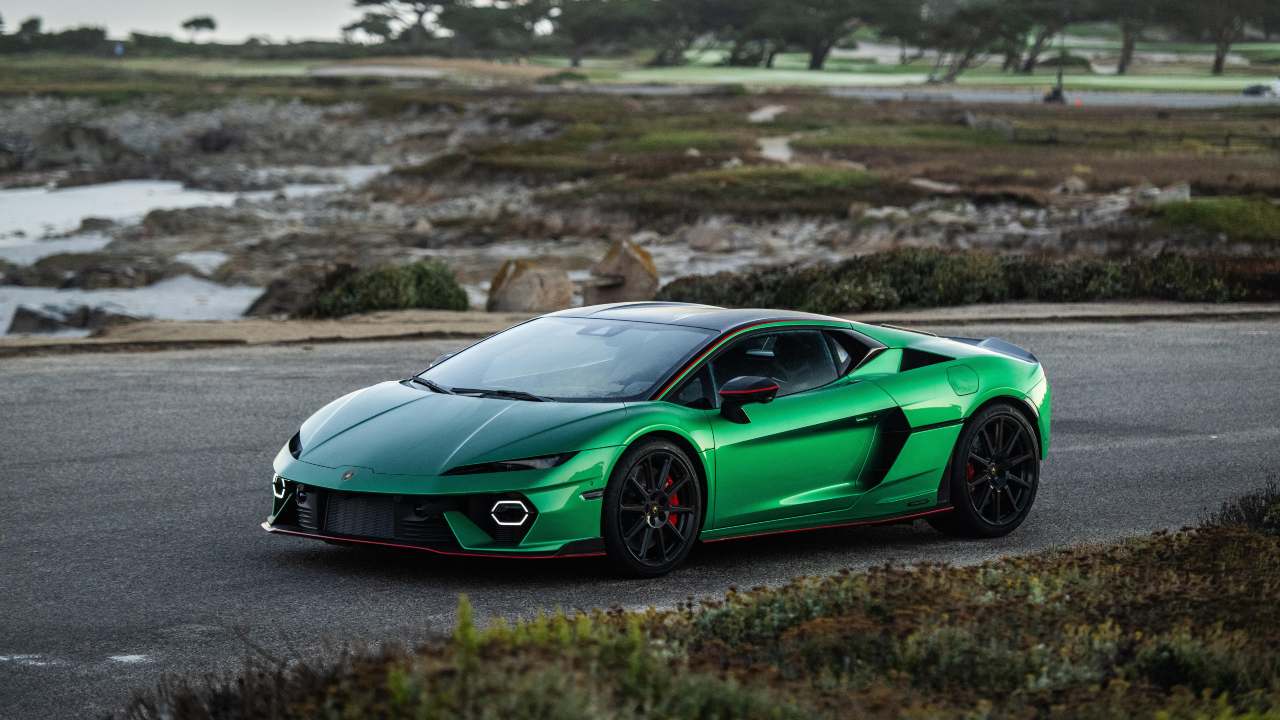 Lamborghini Temerario in green parked beside coastal road, front three-quarter view
