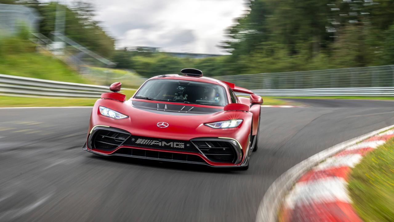 Mercedes-AMG ONE hypercar driving on racetrack, front view with F1-inspired design