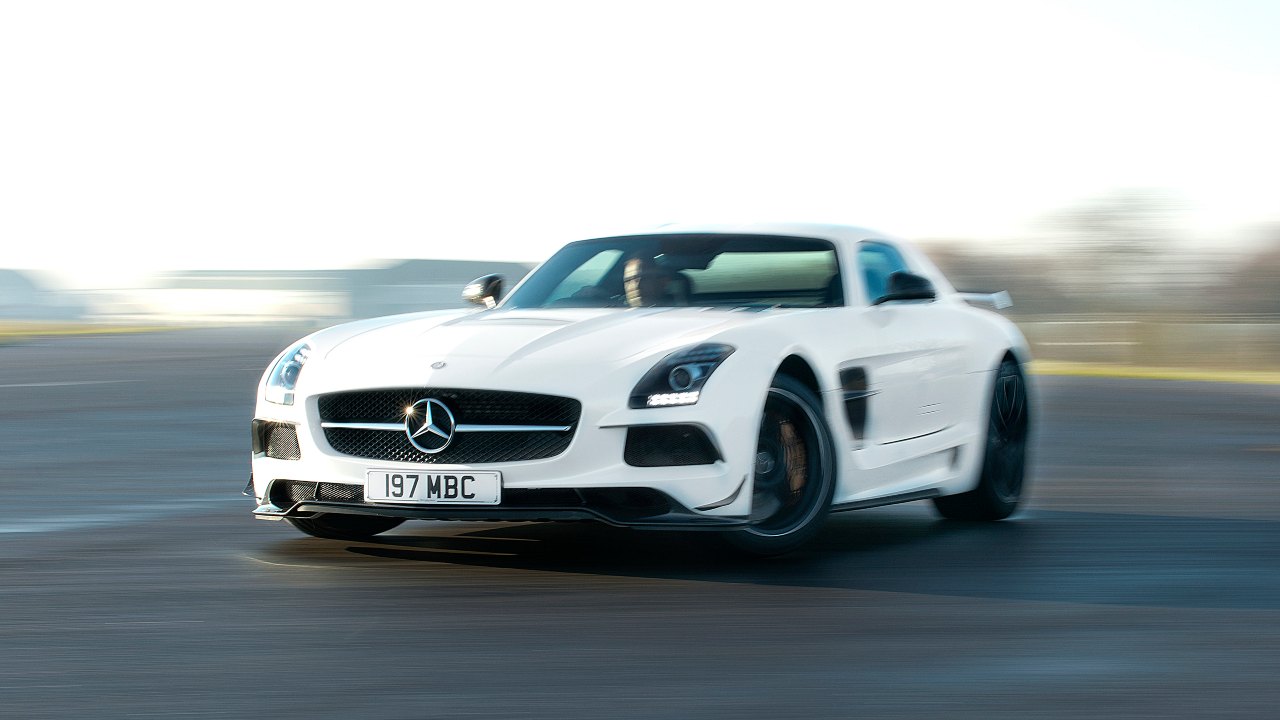 Mercedes-Benz SLS AMG Black Series driving on track with motion blur, front view