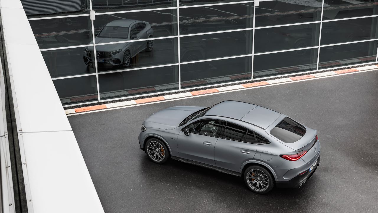 Mercedes-AMG GLC 63 S E PERFORMANCE parked outside a glass-fronted showroom