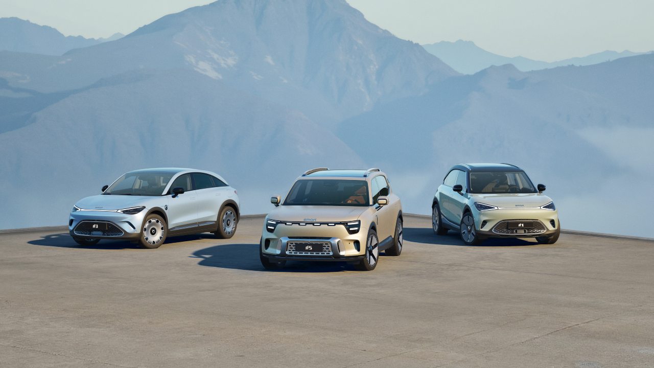 smart electric SUV model lineup parked together with mountain backdrop
