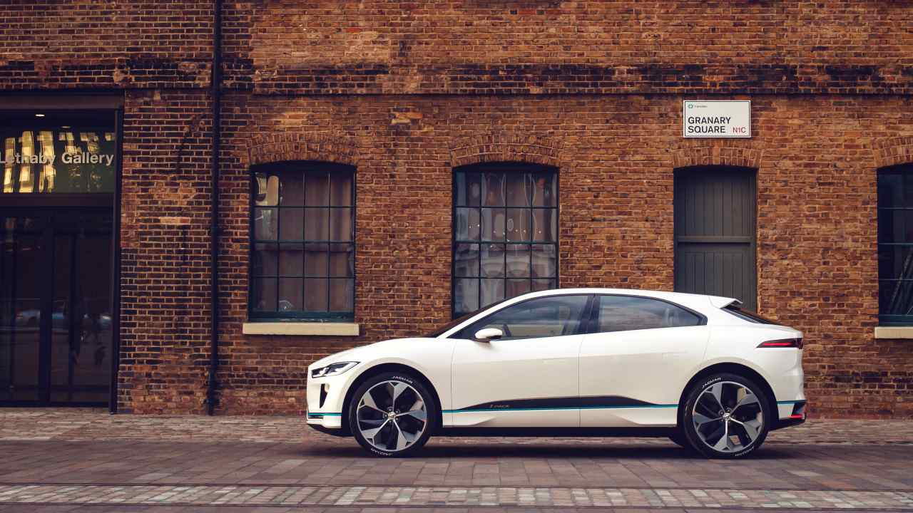 Jaguar I-PACE white side on cobbled street
