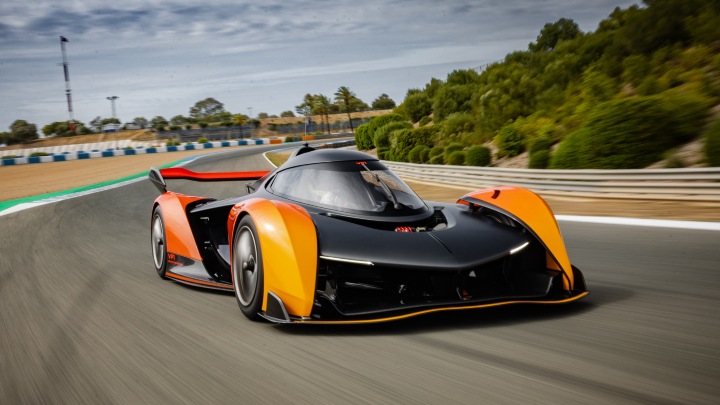 McLaren Solus GT driving at speed on a race track, showcasing aerodynamic design and performance