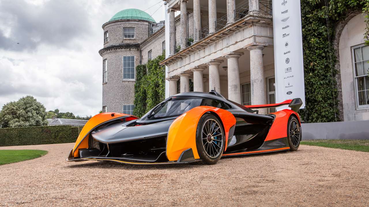 McLaren Solus GT displayed outdoors at Goodwood Festival of Speed with historic architecture in the background