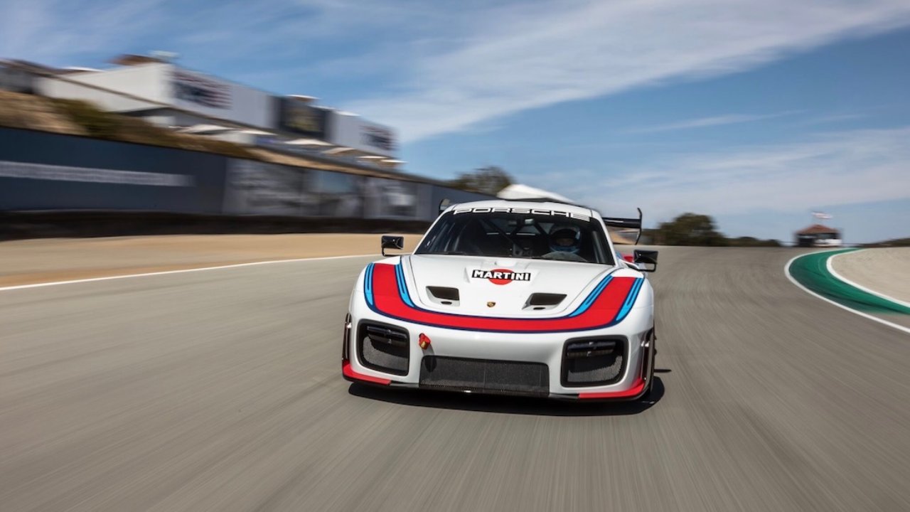 Porsche 935 front view on racetrack with Martini livery, capturing high-speed performance