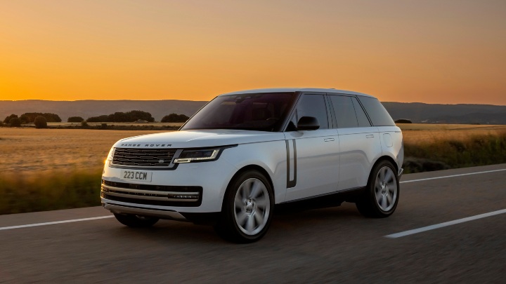 White Range Rover Exterior Front Driving at Sunset