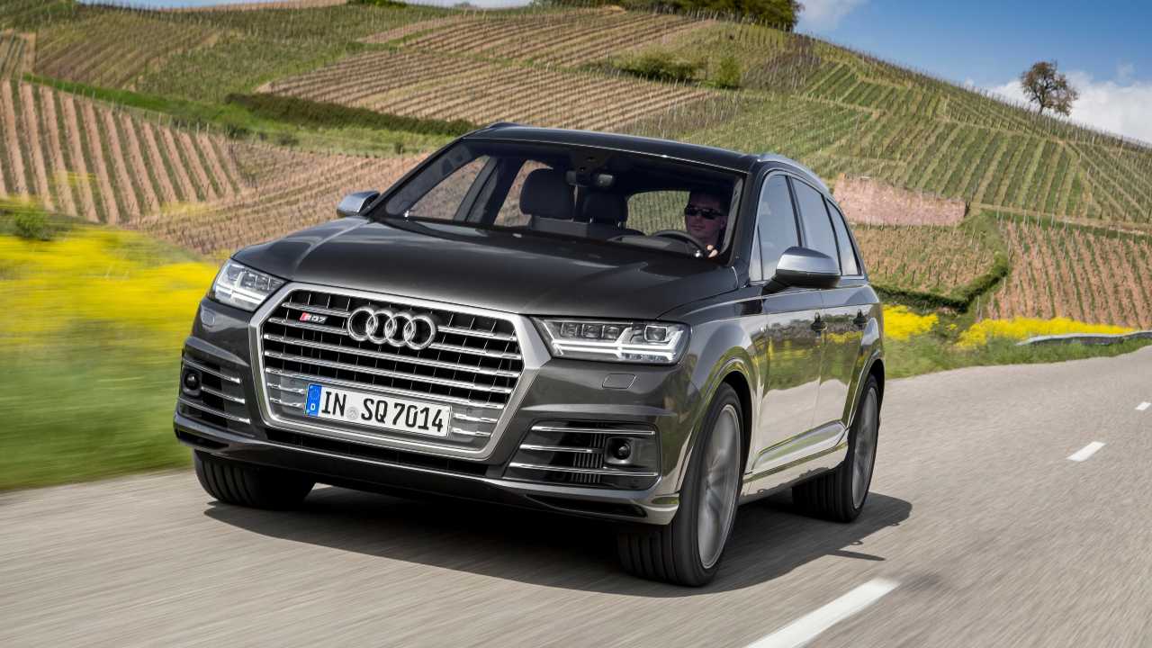 Grey Audi SQ7 Exterior Front Driving Countryside