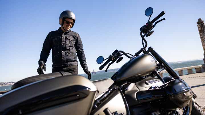 Motorcyclist Standing Next to Black BMW R 18 Roctane