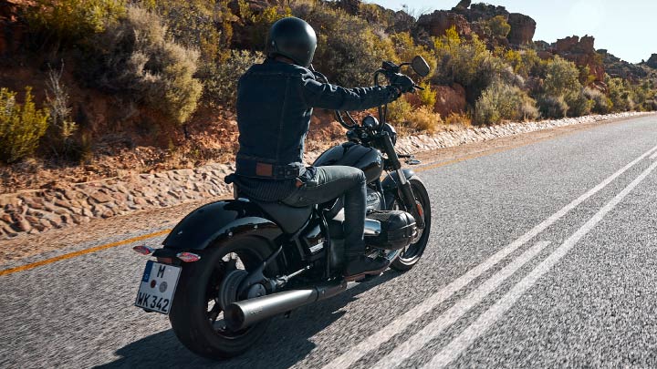 Rear Shot of Motorcyclist Riding Black BMW R 18