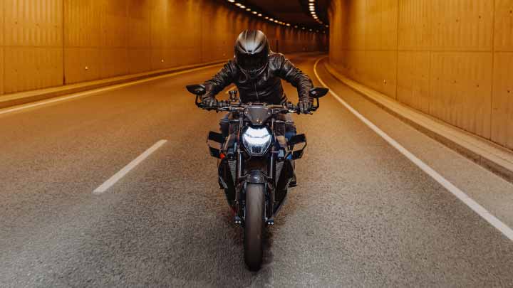 Motorcyclist Riding BMW M 100 R Through Tunnel