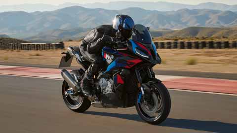 Motorcyclist Riding BMW 1000 XR On Track