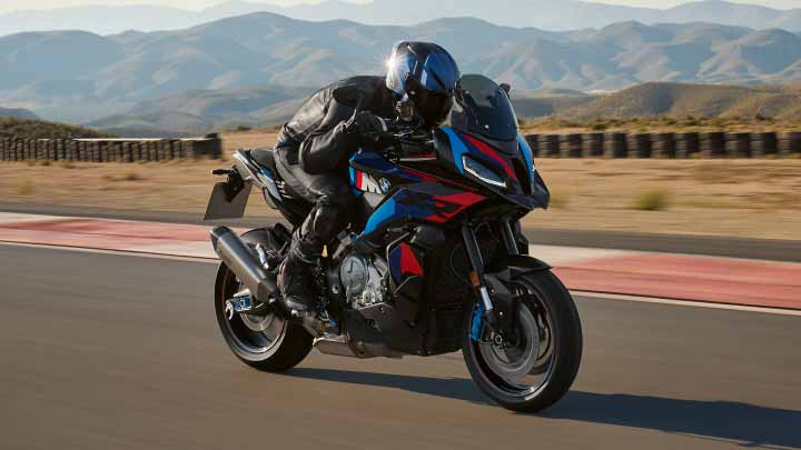 Motorcyclist Riding BMW 1000 XR On Track