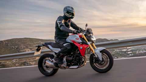 Motorcyclist Riding BMW F 900 R On Mountain Road