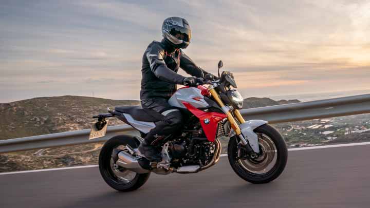 Motorcyclist Riding BMW F 900 R On Mountain Road