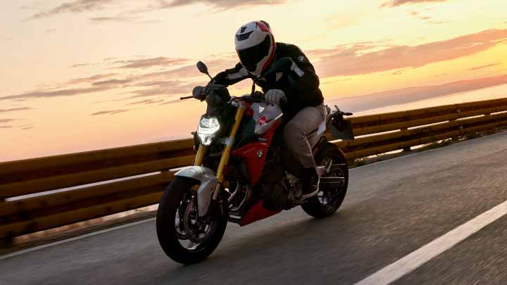 Motorcyclist Riding BMW F 900 R On Mountain Road