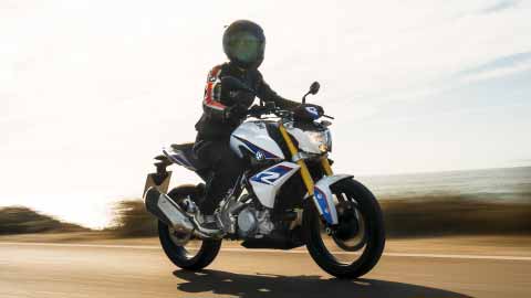 Motorcyclist Riding BMW G 310 R On Mountain Road