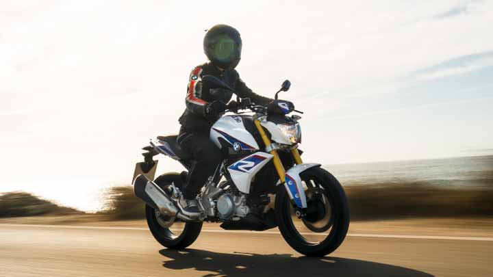 Motorcyclist Riding BMW G 310 R On Mountain Road