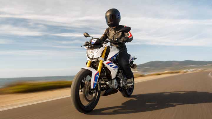 Motorcyclist Riding BMW G 310 R On Mountain Road