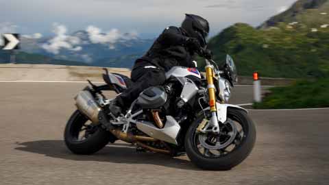 Motorcyclist Riding BMW R 1250 R On Mountain Road
