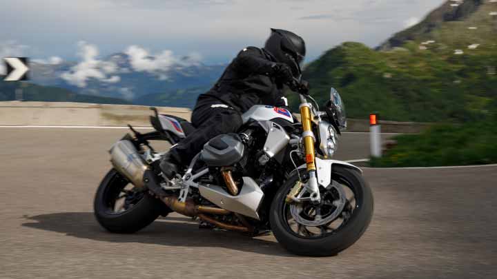 Motorcyclist Riding BMW R 1250 R On Mountain Road