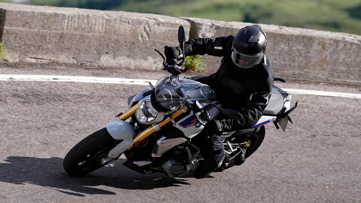 Motorcyclist Riding BMW R 1250 R On Mountain Road