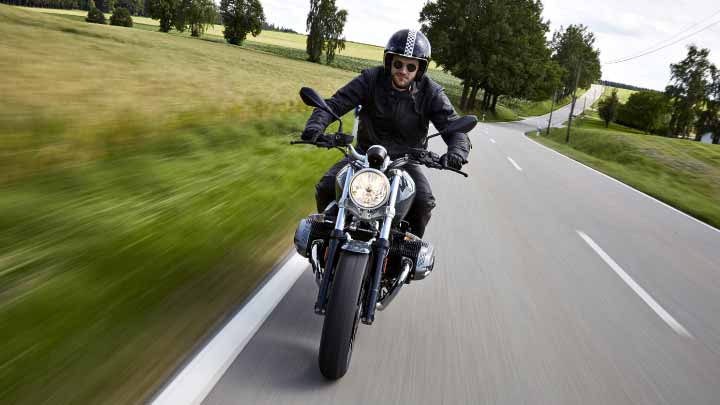 Motorcyclist Riding BMW R NineT Pure On Road