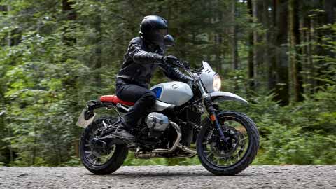 Motorcyclist Riding BMW R NineT Urban GS Forest Road