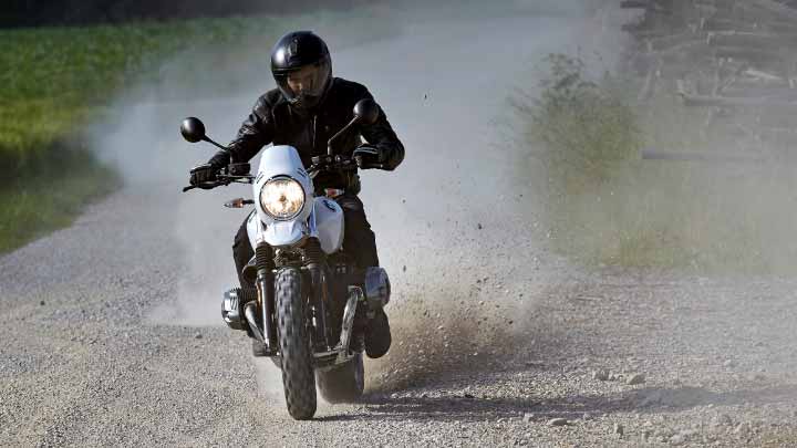 Motorcyclist Riding BMW R NineT Urban GS Forest Road