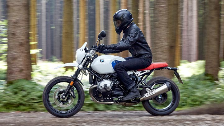 Motorcyclist Riding BMW R NineT Urban GS Forest Road
