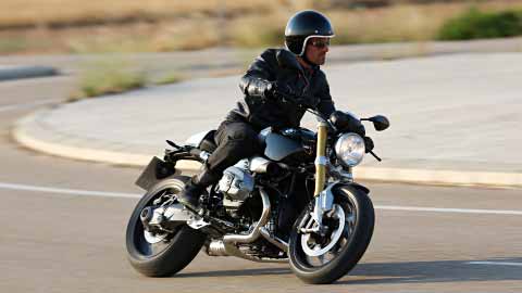 Motorcyclist Riding BMW R NineT On Road