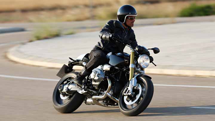 Motorcyclist Riding BMW R NineT On Road