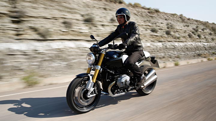Motorcyclist Riding BMW R NineT On Road