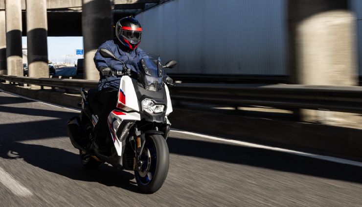 Motorcyclists Riding BMW C 400 X