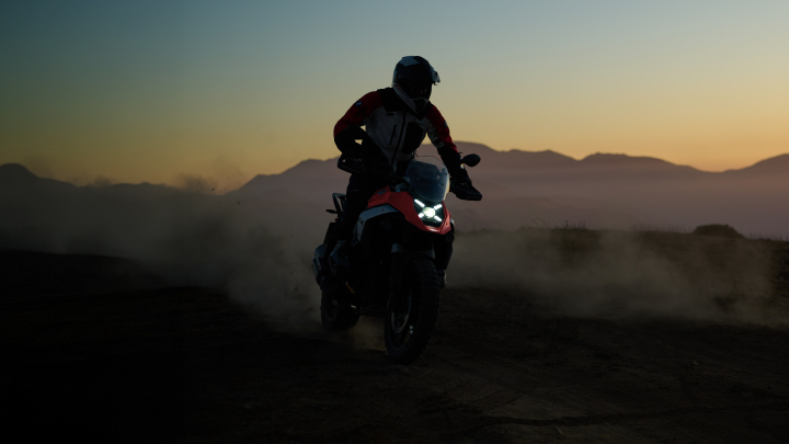 Motorbike rider at dusk