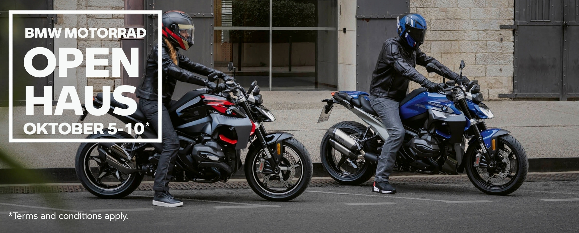 2 People On BMW Motorbikes On A Road