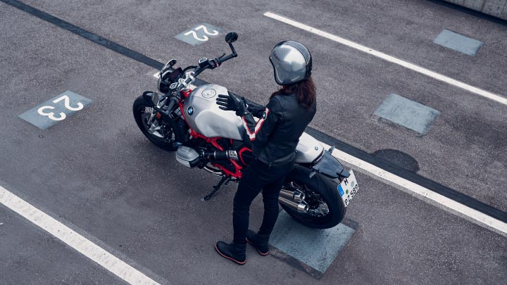 Motorcyclist Standing Next To BMW Motorrad Bike