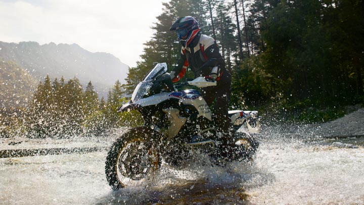 Motorcyclist Riding BMW Motorrad Bike Through Water