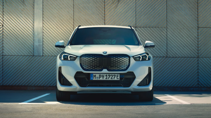 White BMW iX1 Exterior Front Static in Parking Lot