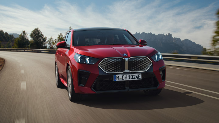 Red BMW iX2 Exterior Front Driving