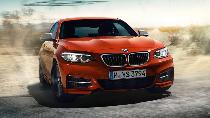 BMW 2 Series Coupe in orange.