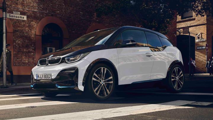 White and black BMW i3 on the road.