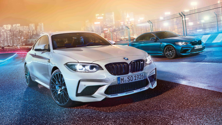 Two BMW M2 Competitions, in white and blue.