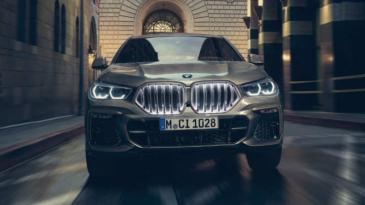 BMW X6 driving on the road.