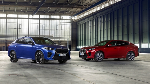 Blue and red BMW parked in a garage
