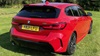 Red BMW 118i M Sport Exterior Rear Static in Field