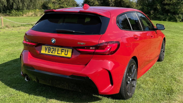 Red BMW 118i M Sport Exterior Rear Static in Field