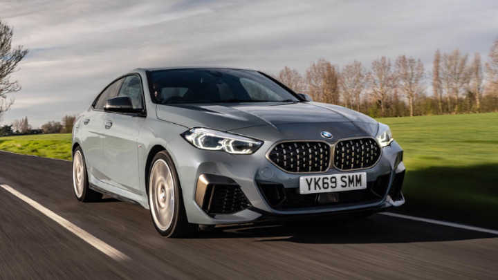 Grey BMW 2 Series Gran Coupe M235i Driving on a Country Road during an Overcast Day